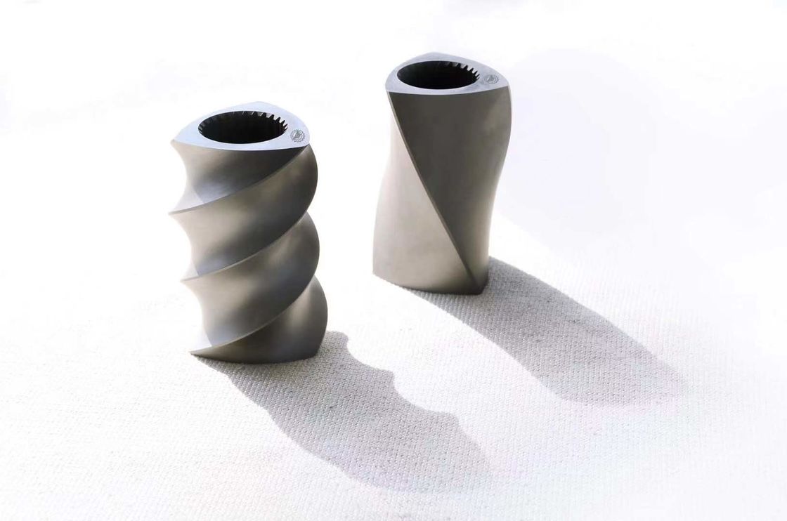 Blocs de transport résistants à la corrosion pour machines à extruder à double vis